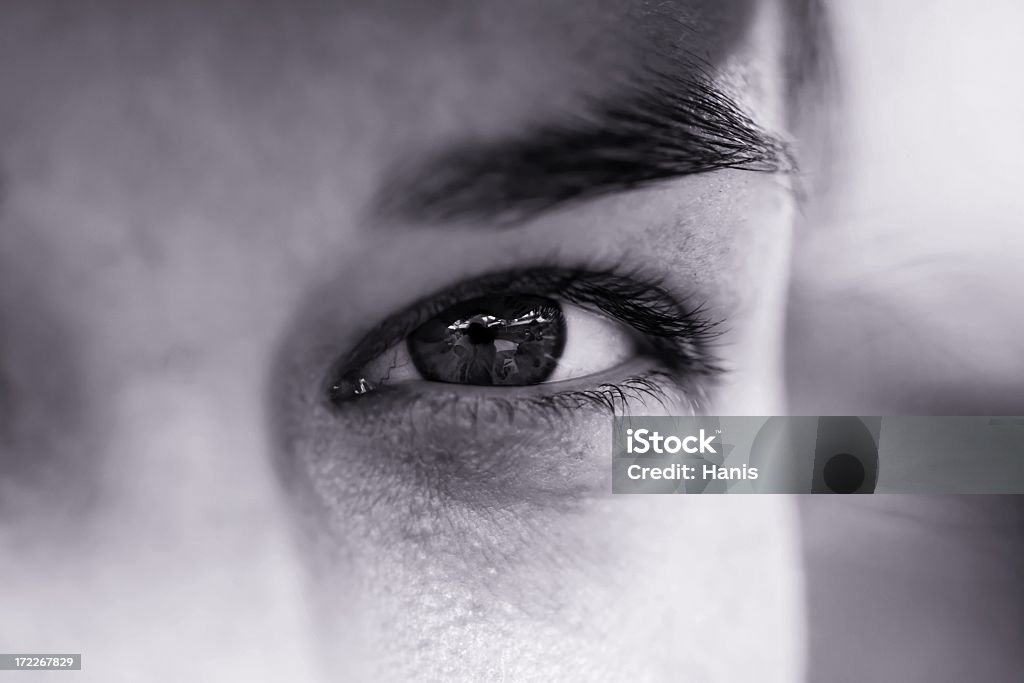 A focus shot of an eye of a man in black and white  Attractive girl's eye in detail Adult Stock Photo