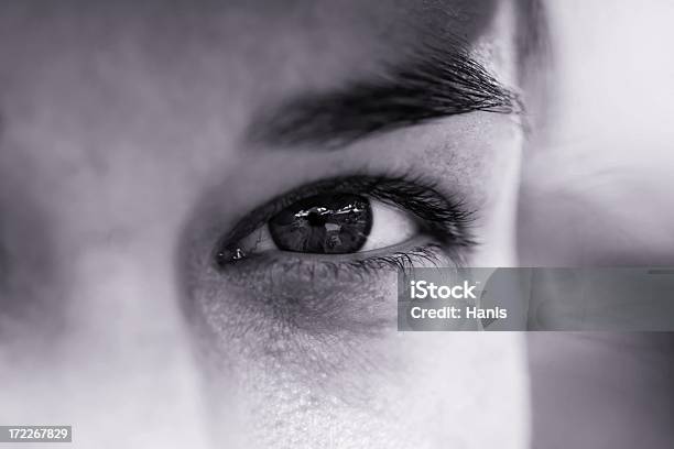 A Focus Shot Of An Eye Of A Man In Black And White Stock Photo - Download Image Now