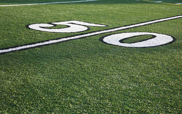 fifty yard line-american football - forty yard line stock-fotos und bilder