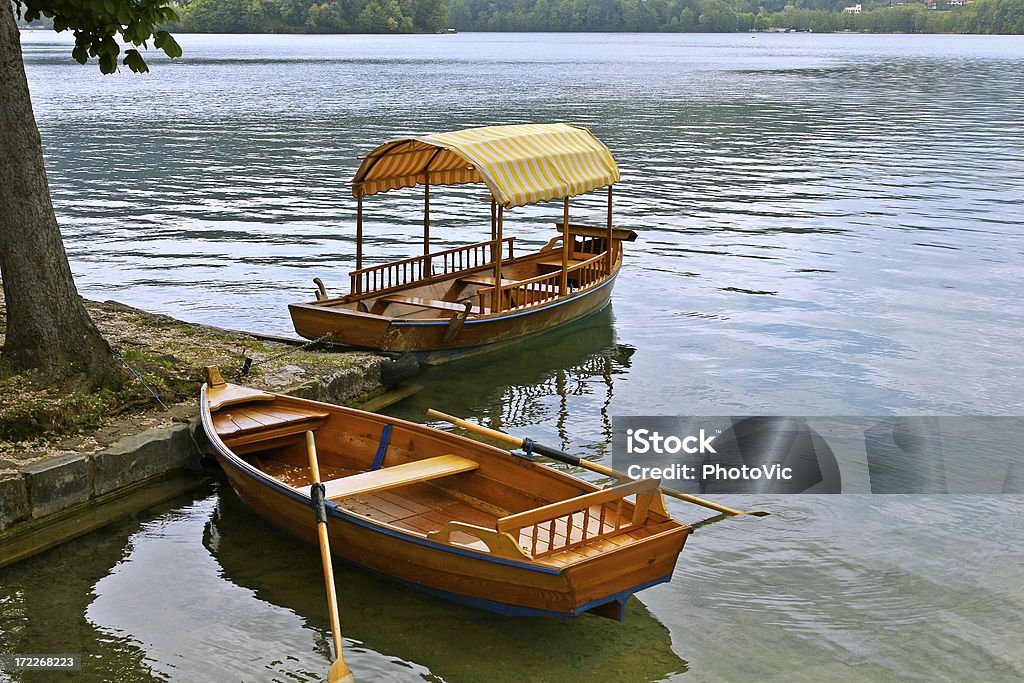 Small Quayside Boats laid-up on Lake Bled Active Lifestyle Stock Photo