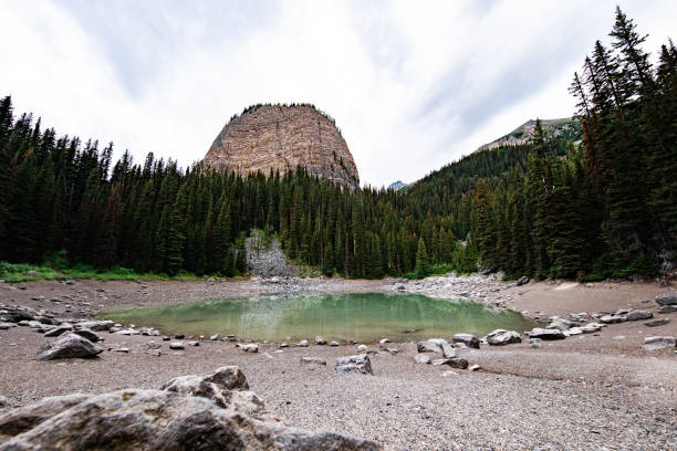 Mirror Lake and mountain at three kilometers up from Lake Louise at Banff National Park, Alberta Canada, taken at the beginning of Autumn with the water starting to get frozen