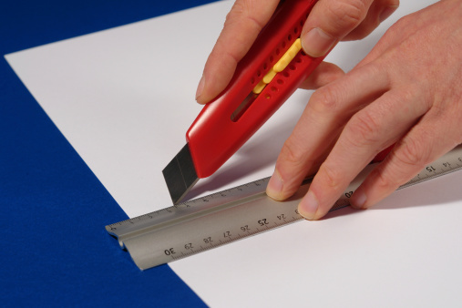 Hobby knife cutting paper