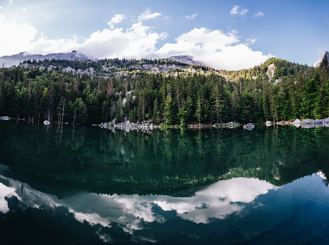 View of the Grundlsee and the surrounding landscape. Idyllic nature by the lake in Styria in Austria. Mountain lake at the Totes Gebirge in the Salzkammergut.