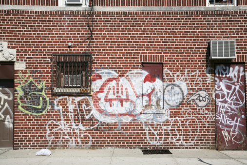 Grafitti on side of building in Bensonhurst, Brooklyn, New York, USA.