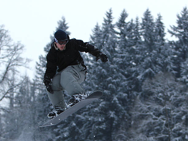 Snow Boarder Catching Air stock photo