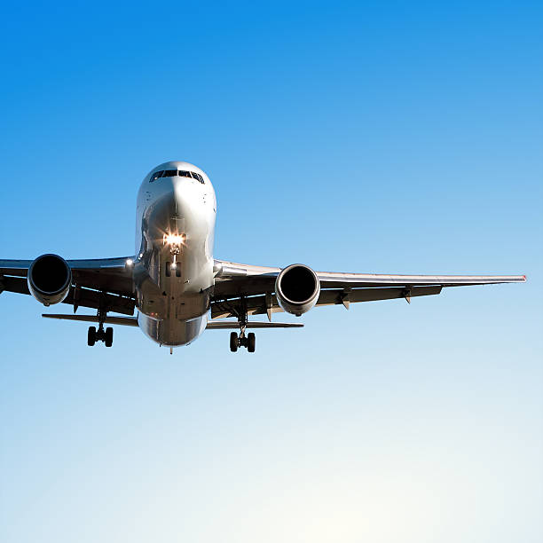 istock jet airplane landing in clear blue sky 172269964