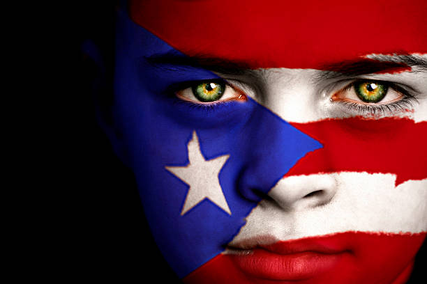 Puerto Rican boy Portrait of a boy with the flag of Puerto Rico painted on his face. puerto rican ethnicity stock pictures, royalty-free photos & images