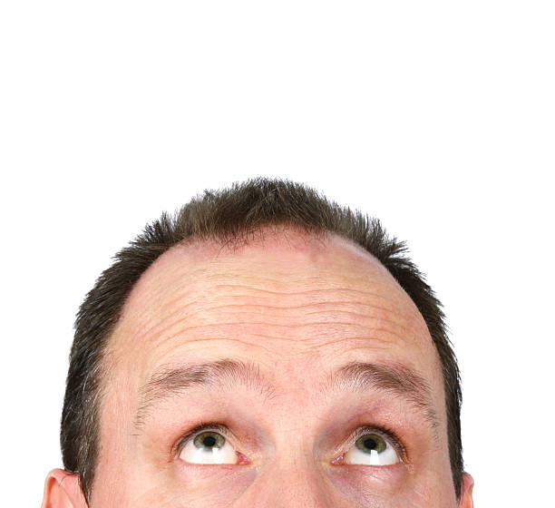 istock A man looking upwards isolated on a white background 172270438