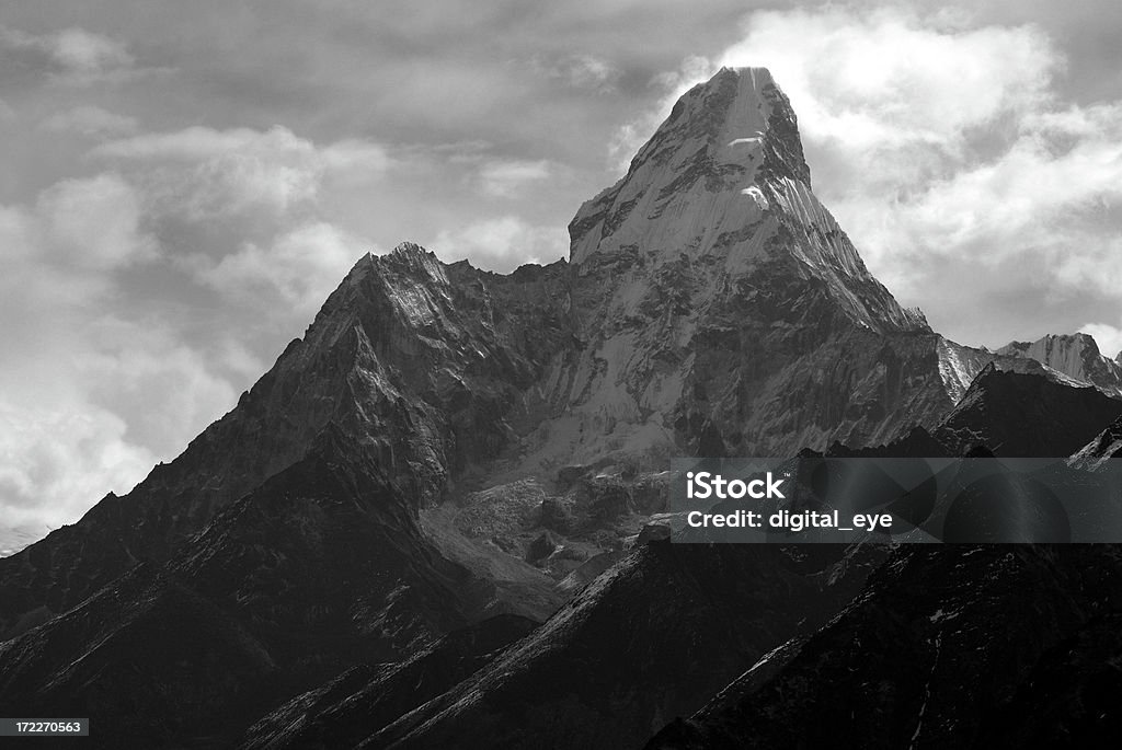 Ama Dablam black and white "Mount Ama Dablam (Nepal, Everest area) on a cloudy morning in april.Holy mountain for the local sherpas.See also my lightbox" Black And White Stock Photo