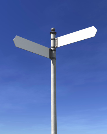 Blank signpost with two arrows over blue sky - just add your text.Precise clipping path included for easy background change.