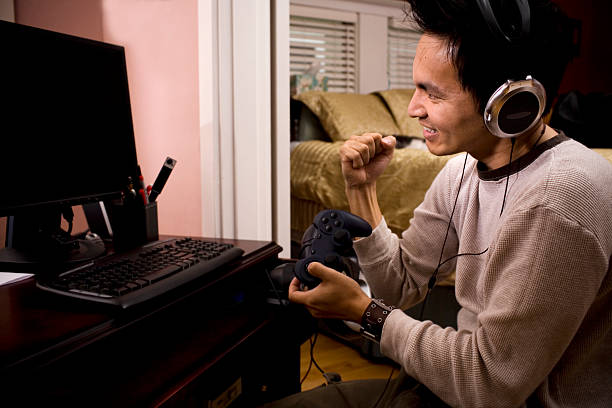 istock Asian Young Man Gamer Using PC at Home, Copy Space 172271357