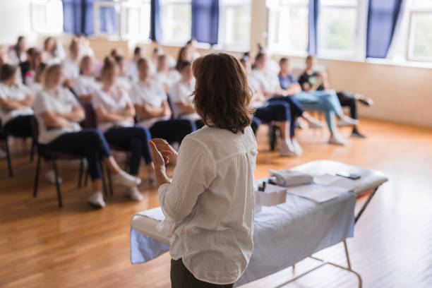 istock Rear-view of a woman having a lecture 1722714079