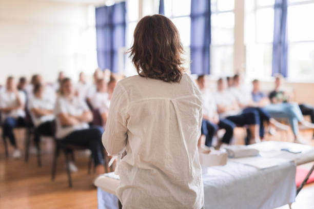 istock Rear-view of a woman having a lecture 1722714602