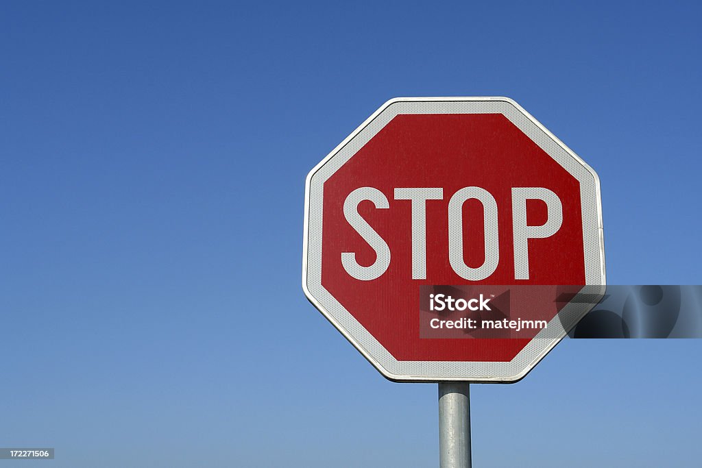 Stop sign Stop sign against clear blue sky Blue Stock Photo