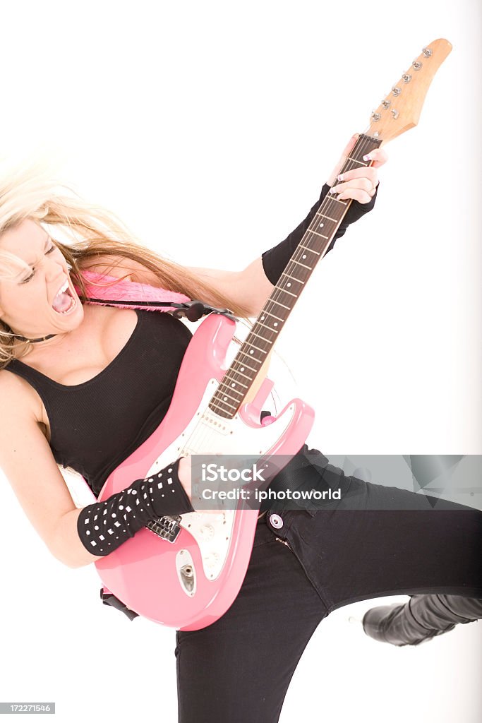 Girl with pink guitar A female jumping in the air with a pink guitar. Rock star!! Adulation Stock Photo