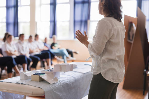 istock Rear-view of a woman having a lecture 1722715682