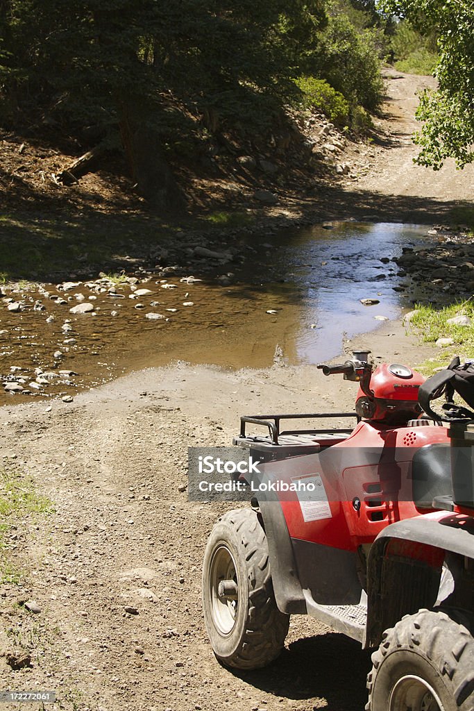 ATV Trail ATV on trail with creek crossing. 4x4 Stock Photo