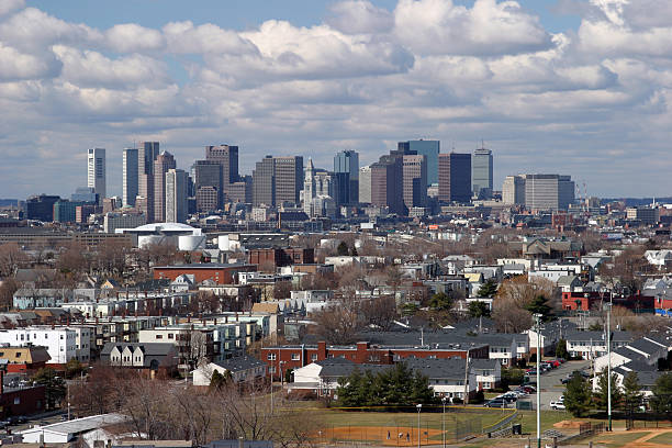 Boston Skyline and Suburbs East Boston skyline showing East Boston and suburbs.  Three decker homes are also shown. east boston stock pictures, royalty-free photos & images