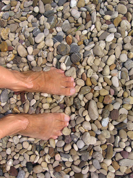 istock Women relaxing with foot in water 172272497