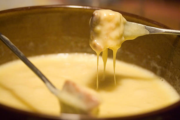 fondue - fondue fork photos et images de collection