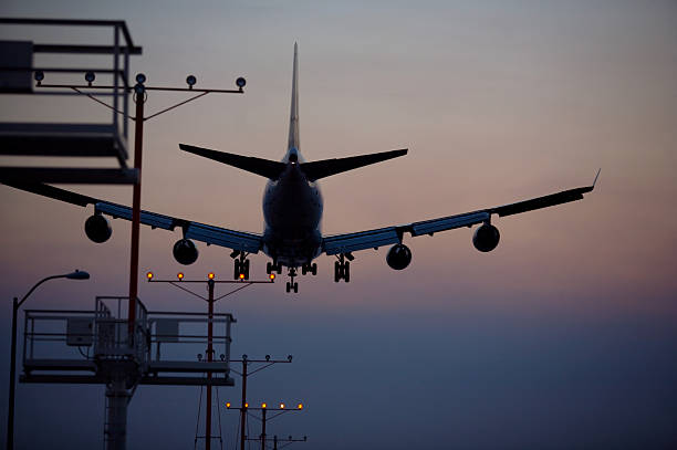 istock Airplane landing at dusk 172272611