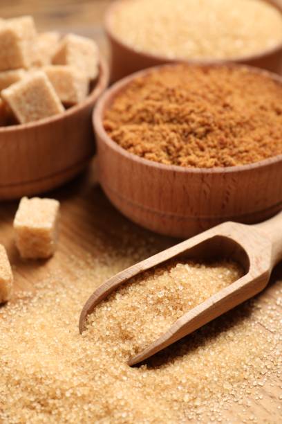 istock Different types of sugar on wooden table, closeup 1722737931