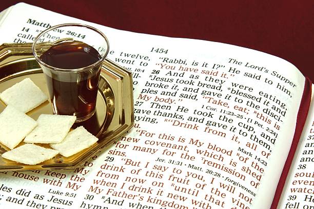 Religious: The Lord's Supper with open Bible stock photo