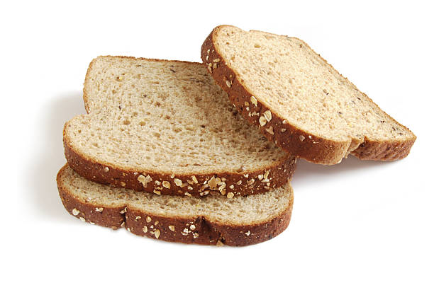Three slices of bread stacked on top of each other Bread slices Brown Bread stock pictures, royalty-free photos & images
