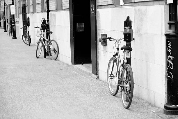 istock Four bicycles locked to parking meters 172274804