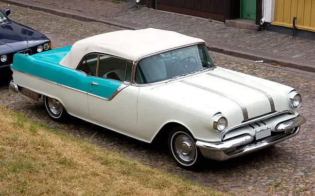 "1950s classic american car, lots of chrome."