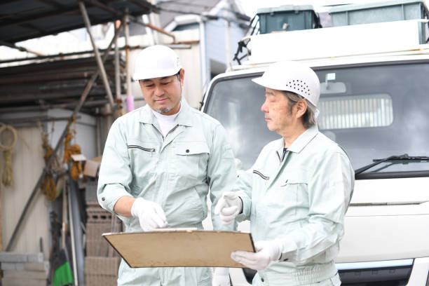 istock Middle-aged Asian male workers having a meeting at a construction site 1722749443