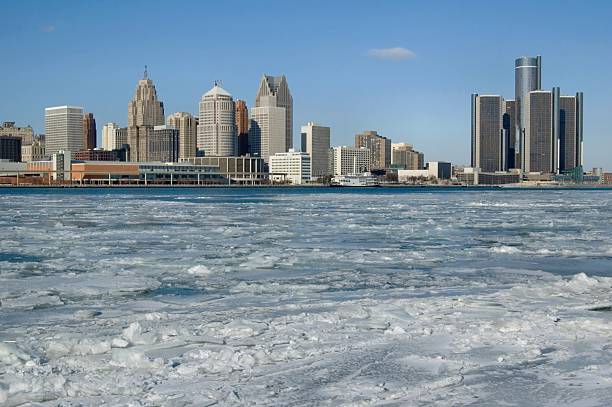 Frozen Detroit River and the Skyline of Detroit "Ice in the Detroit River and the Skyline of Detroit, Michigan; view from Canada to the United States" cobo hall photos stock pictures, royalty-free photos & images