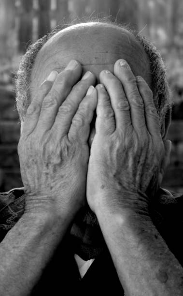 istock hands covering face of old man 172275121