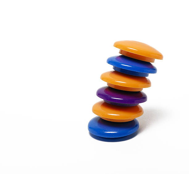 stacked colored magnets stock photo