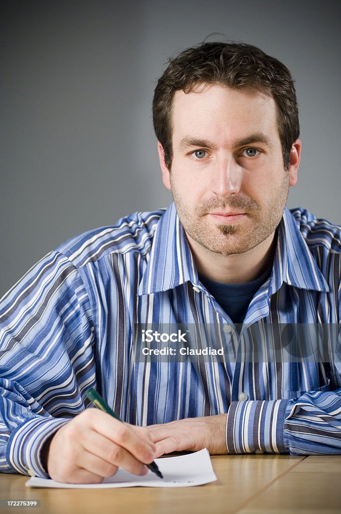 Man is writing- series "Man is writing a letterClick on the banner below, and you find similar pics of that model:" Adult Stock Photo