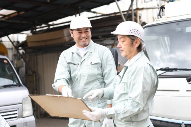 istock Middle-aged Asian male workers having a meeting at a construction site 1722759723