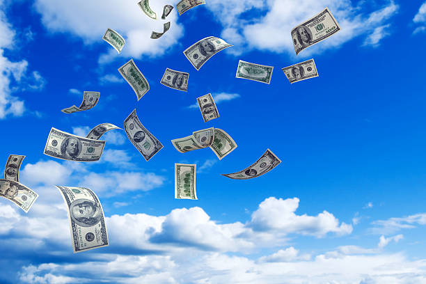Money Rain Hundred dollar bills falling - Highly detailed money images on sky background. pennies from heaven stock pictures, royalty-free photos & images