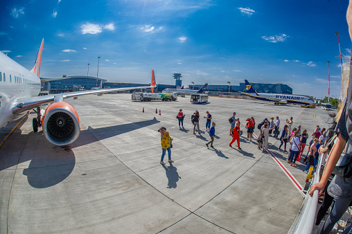 03 -October -2023-Bucharest-Romania-Ukrainian low-cost airline Sky Up is on the runway of Henri Coanda International Airport in Bucharest. Passengers are waiting to board.