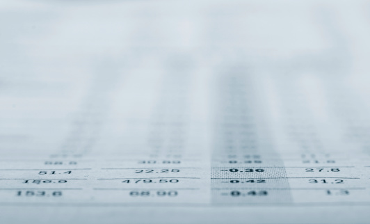 Financial data. Macro shot with very low depth of field. Focus in front.
