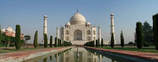 Agra, India - 09.11.2022 - Taj Mahal white marble mausoleum landmark in Agra, Uttar Pradesh, India, beautiful ancient tomb building of Mughal architecture, popular touristic place marble exterior