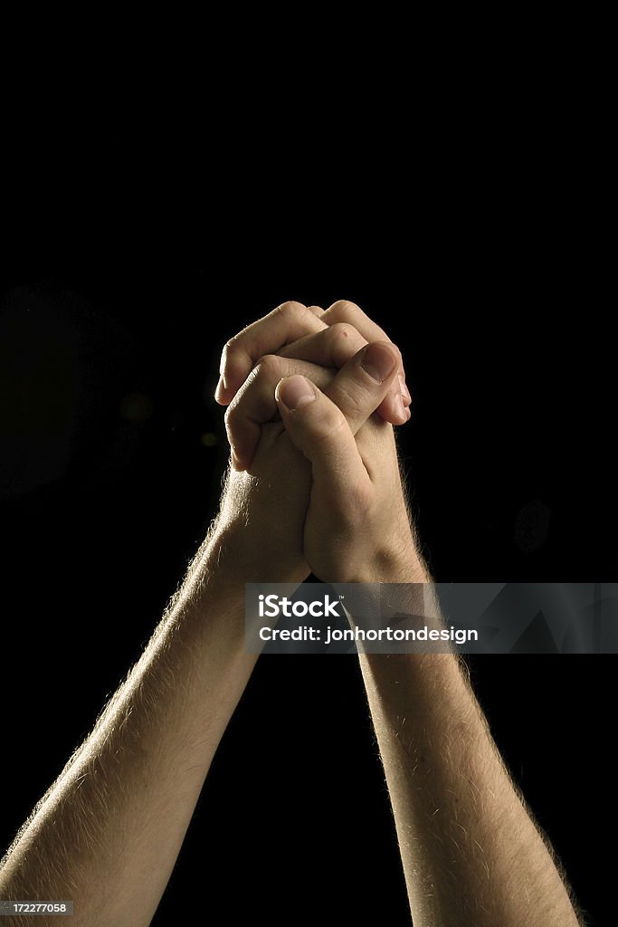 Prayerful Hands "nicely lit hands on black, posed in prayer.Other Images in This Series:" Christianity Stock Photo