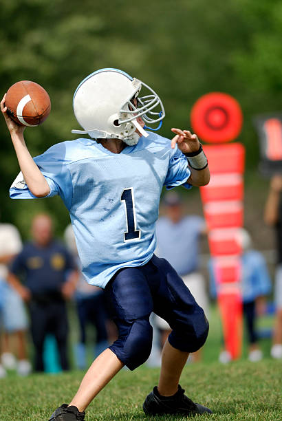 istock Youth football player throwing a pass. 172277709