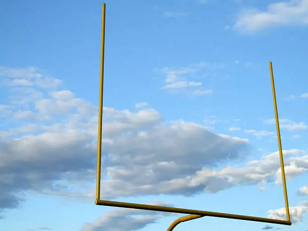 Football goal against bright blue and cloudy sky.  See my other football (shots