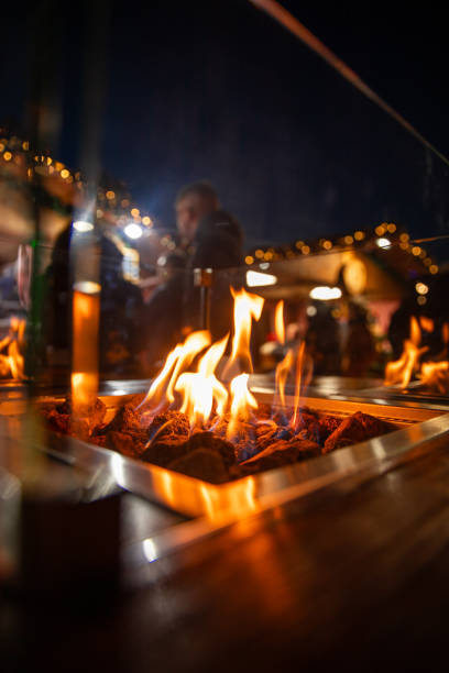 Christmas Market fire pit with cozy winter atmosphere at Bardolino Lake Garda winter celebration festival stock photo