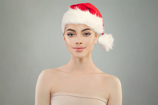 Christmas woman wearing red Santa hat, Xmas portrait