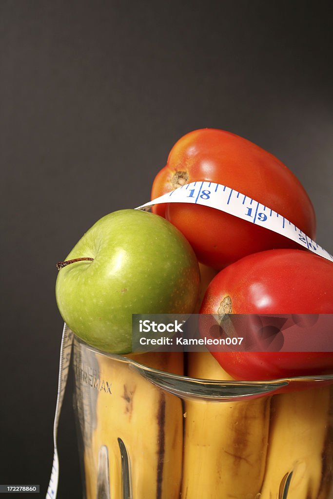 Vegetables in the blender fruits and vegetable Apple - Fruit Stock Photo