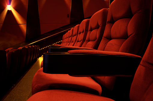 Red velvet seats of an opera house.