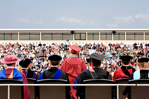 Back of College Graduation Ceremony with Crowd, Copy Space stock photo