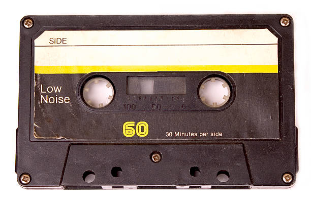 Retro cassette tape with yellow label Cassette Tape audio cassette photos stock pictures, royalty-free photos & images
