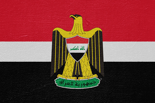 Flag and coat of arms of Republic of Iraq on a textured background. Concept collage.